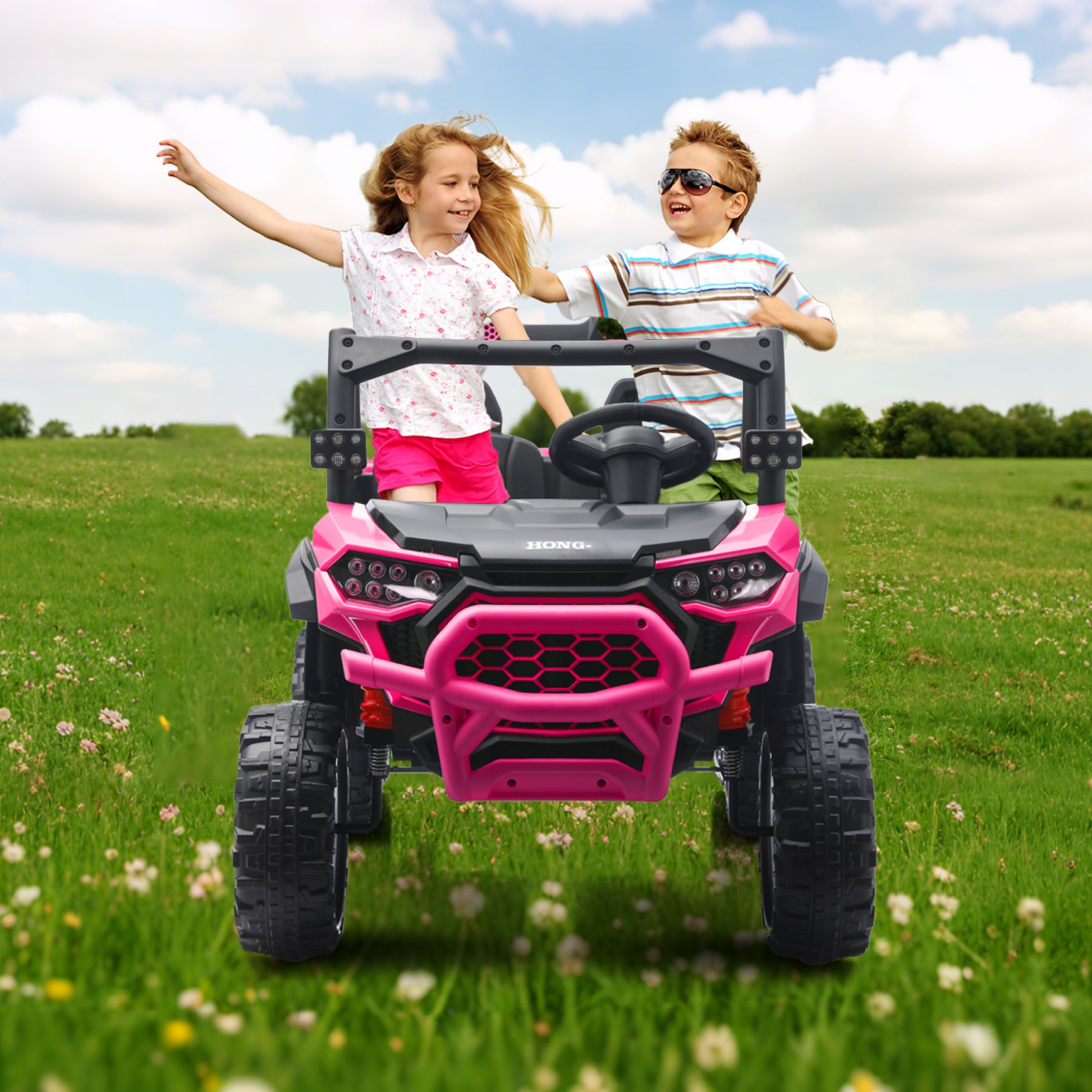 Two happy children playing in a pink HEIMILI 2-seater ride-on truck on a green grassy field, showcasing the powerful off-road performance, bright LED lights, and shared driving fun for siblings.