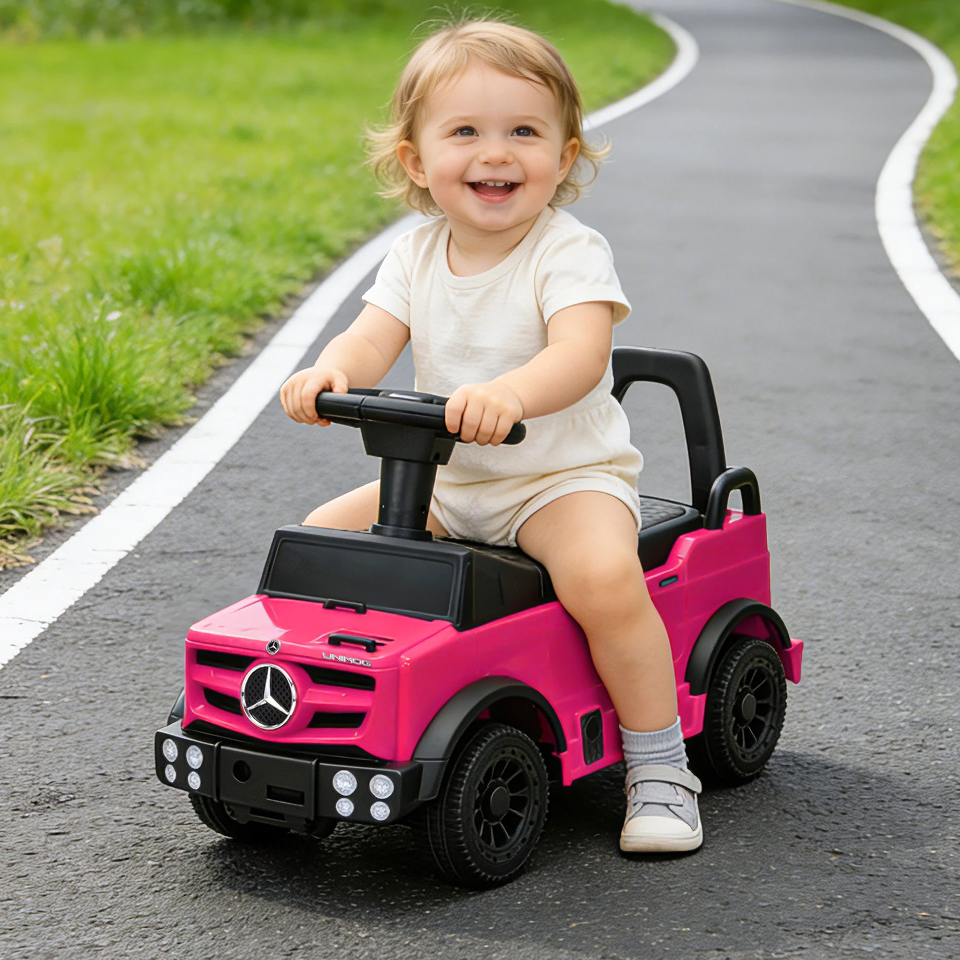 Authentic Mercedes-Benz Unimog licensed kids push car in pink, featuring a foot-to-floor design for toddler walking support and balance building, suitable for children under 3 years old